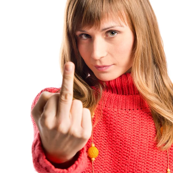Serious girl making horn gesture over white background — Stock Photo, Image