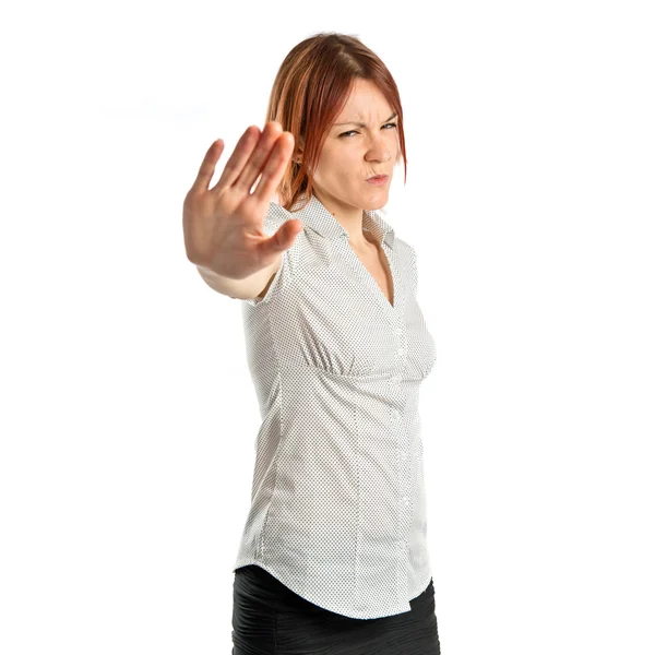 Mujer bonita haciendo señal de stop sobre fondo blanco — Foto de Stock