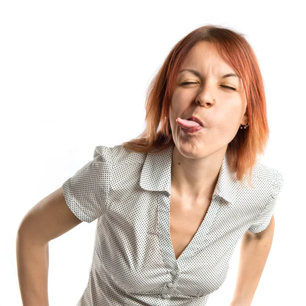 Menina fazendo uma piada sobre fundo branco isolado — Fotografia de Stock