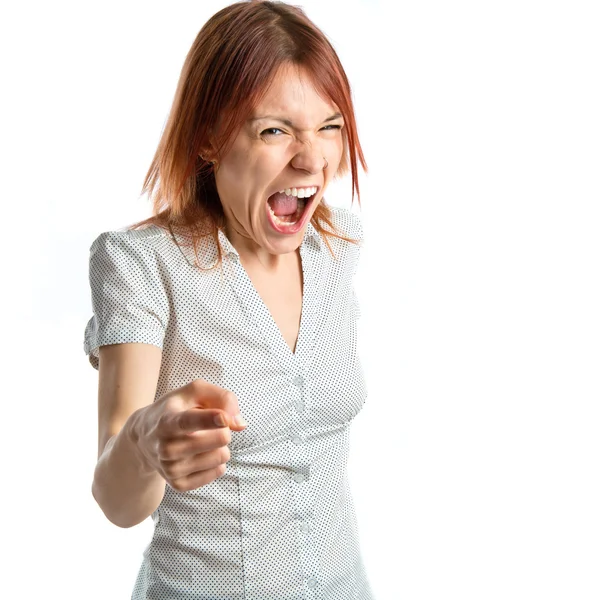 Young girl shouting and pointing over white background — Stock Photo, Image