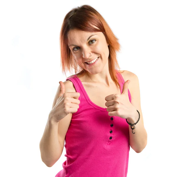 Pretty young girl with thumbs up over white background — Stock Photo, Image