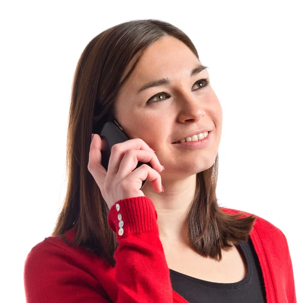 Young girl talking on mobile over white background — Stock Photo, Image