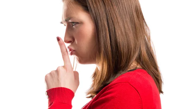 Young girl making silence gesture over isolated white background — Stock Photo, Image