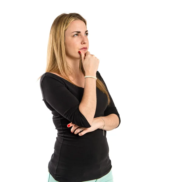 Young girl thinking over isolated white background — Stock Photo, Image