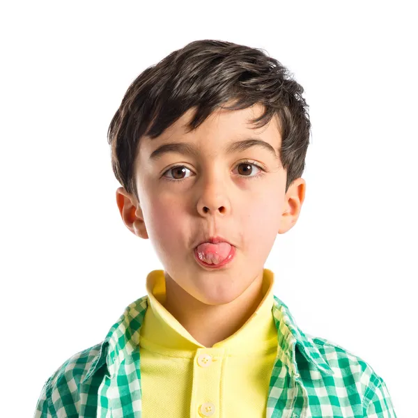 Boy making a mockery over isolated background — Stock Photo, Image