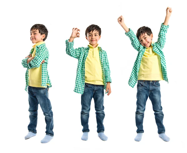 Boys making a victory sign on wooden chair over white background — Stock Photo, Image