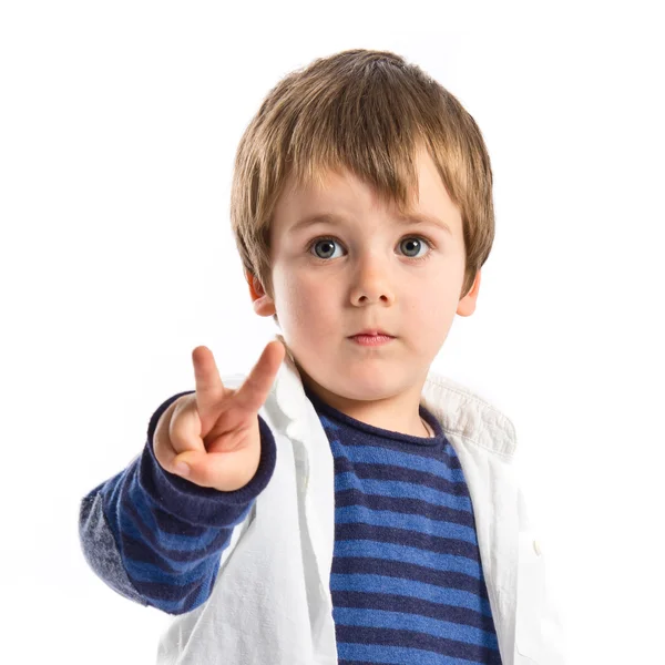 Boys making a victory sign over white background Stock Photo