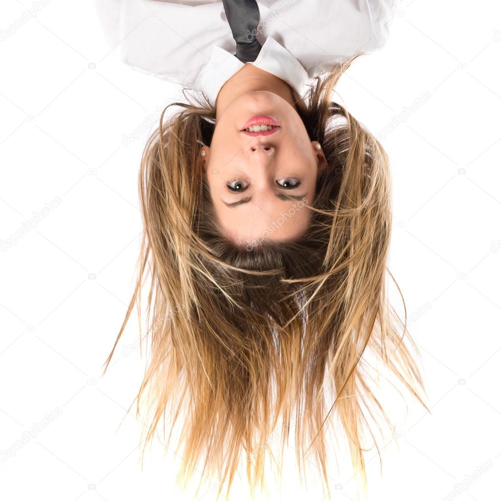 Young pretty girl moving her hair over white background 