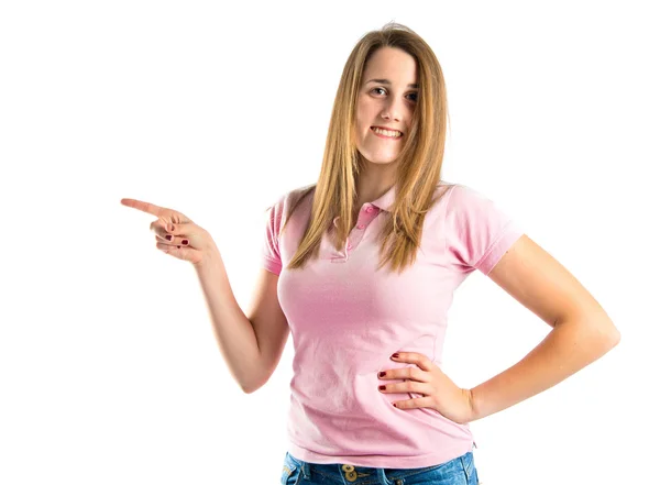 Young pretty woman pointing over white background — Stock Photo, Image