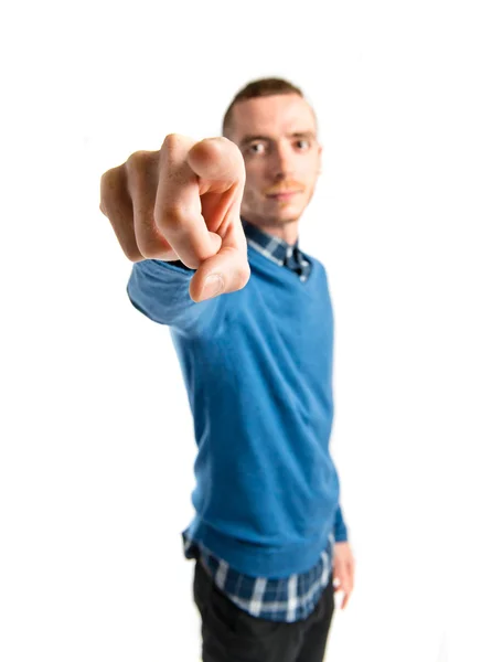 Young man pointing over isolated white background Stock Photo