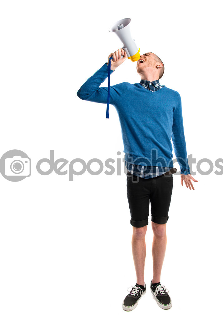 Redhead man shouting by megaphone over white background 