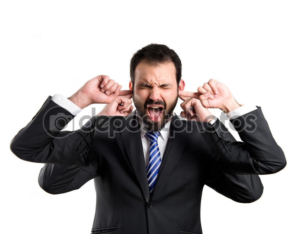 business man covering her ears over white background 