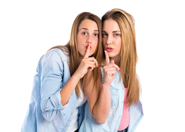 Friends making silence gesture over isolated white background — Stock Photo, Image