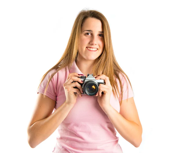 Girl taking a picture over white background — Stock Photo, Image