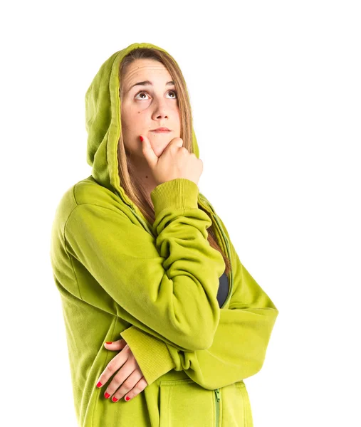 Chica joven pensando sobre fondo blanco aislado — Foto de Stock