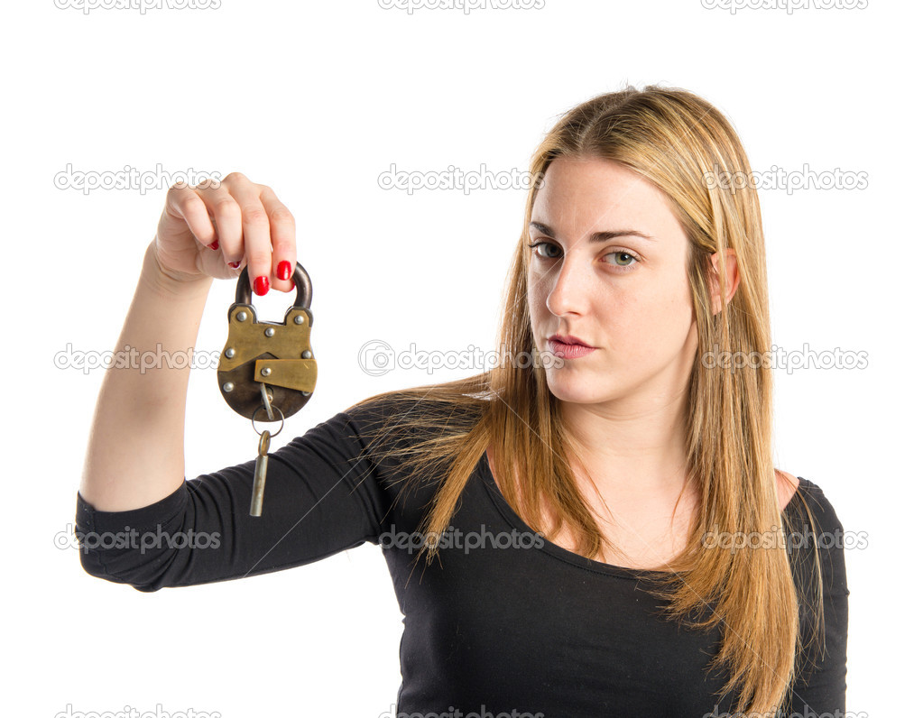 Blonde girl holding vintage padlock over white background 