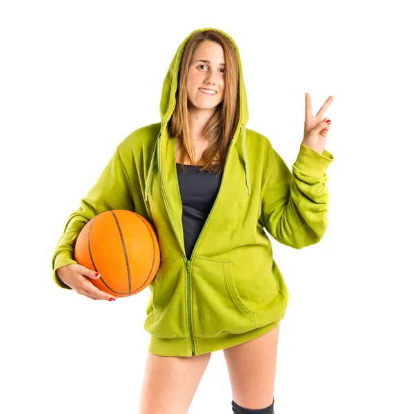 Young girl doing victory gesture over white background — Stock Photo, Image