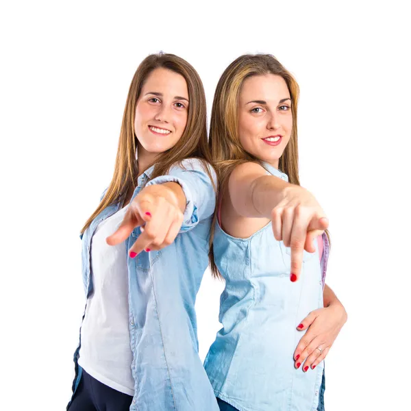 Girls pointing to the front over white background — Stock Photo, Image