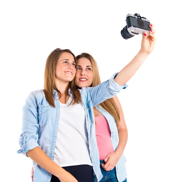 Girl photographing over white background — Stock Photo, Image