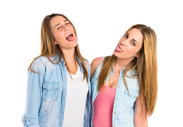 Friends doing a joke over isolated white background