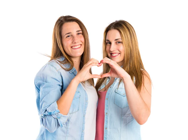 Friends make a heart with her hands over white background — Stock Photo, Image