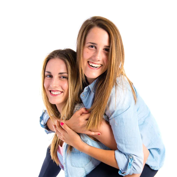 Hermanas jugando sobre fondo blanco — Foto de Stock