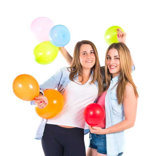 Friends with many balloons over white background — Stock Photo, Image