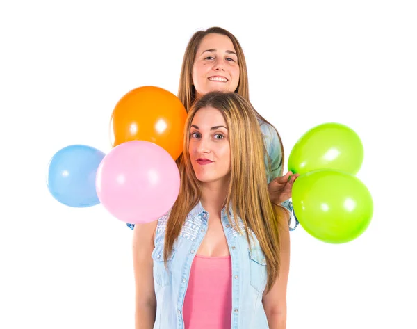 Friends with many balloons over white background — Stock Photo, Image