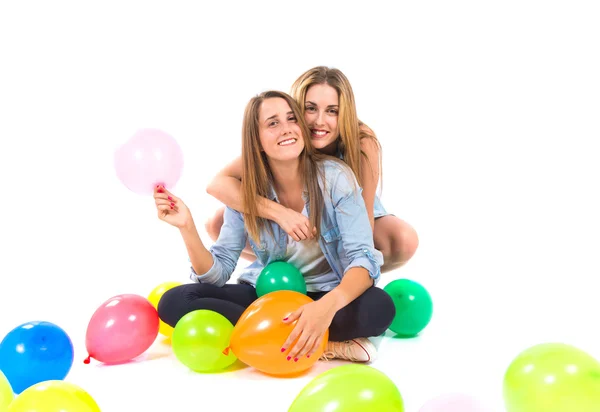 Friends with many balloons over white background — Stock Photo, Image