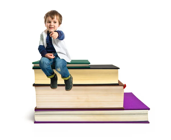 Boy pointing to the front over white background — Stock Photo, Image