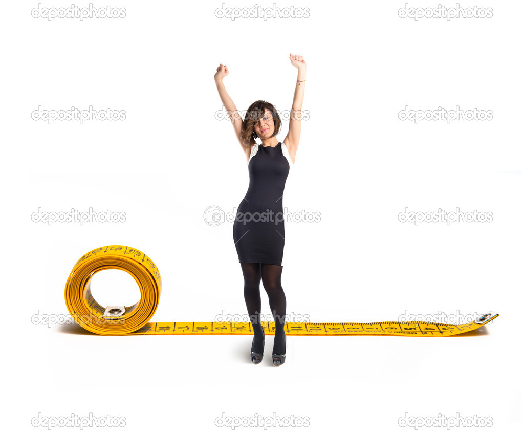 Happy woman with tape measure over white background 