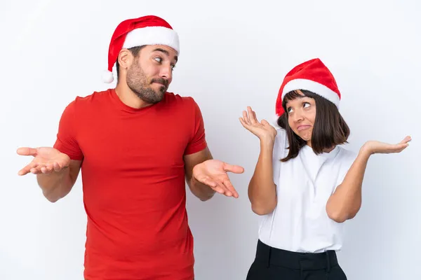 Young Couple Christmas Hat Isolated White Background Making Unimportant Gesture — Stock Photo, Image