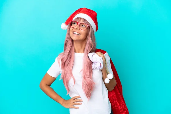 Young Mixed Race Woman Handing Out Gifts Christmas Isolated Blue — Stock Photo, Image