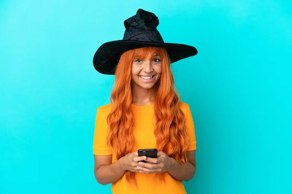 Young Woman Disguised Witch Isolated Blue Background Sending Message Mobile — Stock Photo, Image
