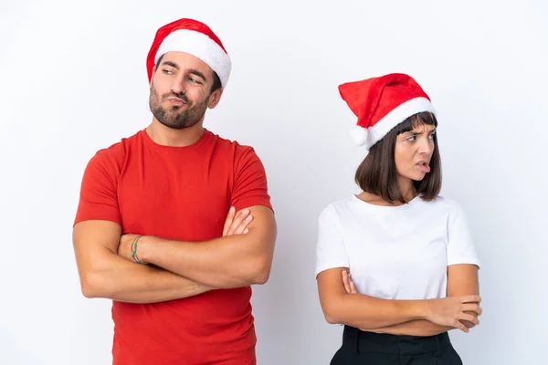 Junges Paar Mit Weihnachtsmütze Isoliert Auf Weißem Hintergrund Mit Verwirrtem — Stockfoto