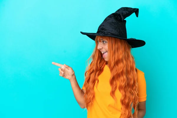 Young Woman Disguised Witch Isolated Blue Background Pointing Finger Side — Stock Photo, Image