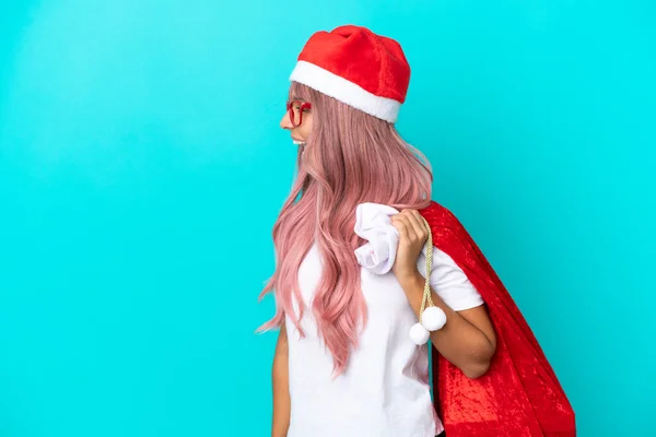 Young Mixed Race Woman Handing Out Gifts Christmas Isolated Blue — Stock Photo, Image