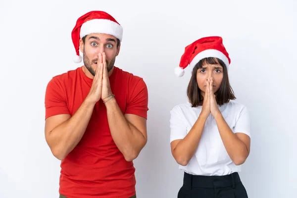 Junges Paar Mit Weihnachtsmütze Auf Weißem Hintergrund Hält Palme Zusammen — Stockfoto