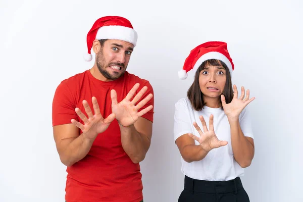 Junges Paar Mit Weihnachtsmütze Isoliert Auf Weißem Hintergrund Ist Ein — Stockfoto