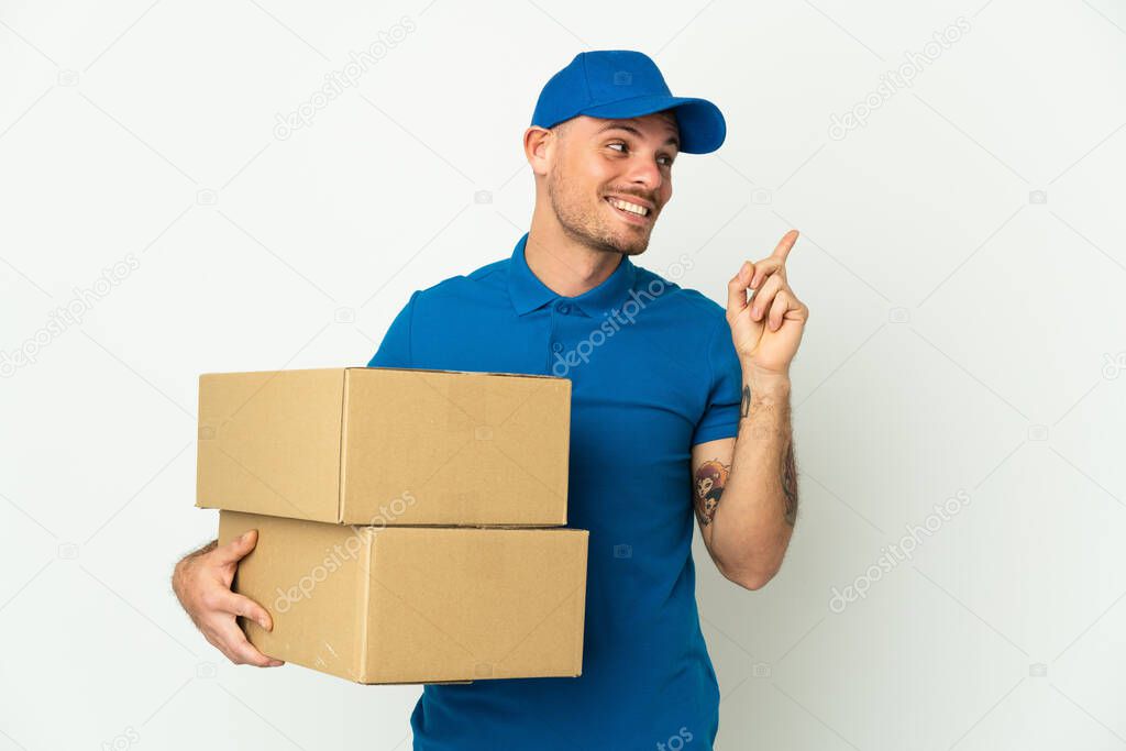 Delivery caucasian man isolated on white background intending to realizes the solution while lifting a finger up
