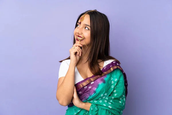 Young Indian Woman Isolated Purple Background Looking — Stock Photo, Image