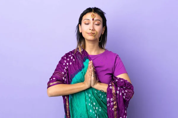 Indian woman isolated on purple background