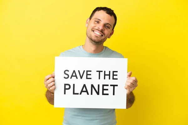 Brazylijczyk Odizolowanym Fioletowym Tle Tabliczką Tekstem Planet Happy Expression — Zdjęcie stockowe