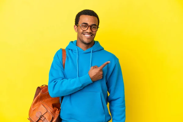 African American Student Man Isolated Yellow Background Pointing Side Present — Stock Photo, Image