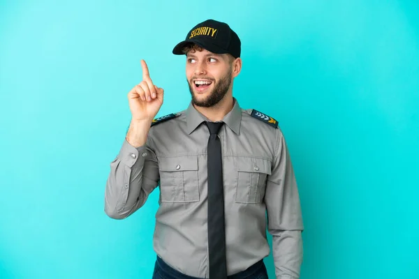 Joven Hombre Seguridad Aislado Sobre Fondo Azul Con Intención Realizar — Foto de Stock