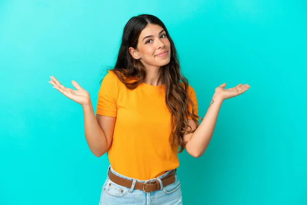 Young Caucasian Woman Isolated Blue Background Making Doubts Gesture — Stock Photo, Image