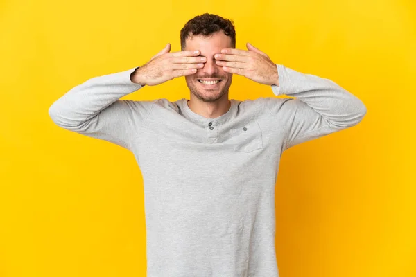 Young Caucasian Handsome Man Isolated Yellow Background Covering Eyes Hands — Stock Photo, Image