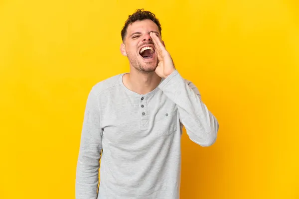 Young Caucasian Handsome Man Isolated Yellow Background Shouting Mouth Wide — Stock Photo, Image