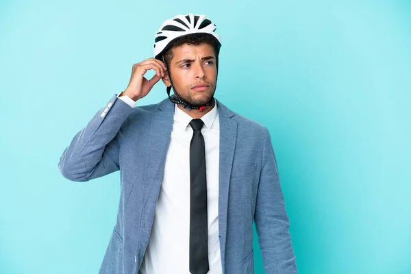 Молодой Бизнесмен Бразилец Велосипедным Шлемом Изолирован Синем Фоне Сомнениями Запутанным — стоковое фото