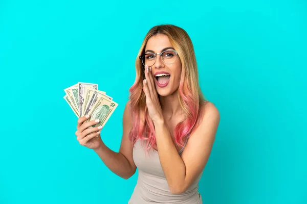 Young Woman Taking Lot Money Isolated Blue Background Whispering Something — Stock Photo, Image